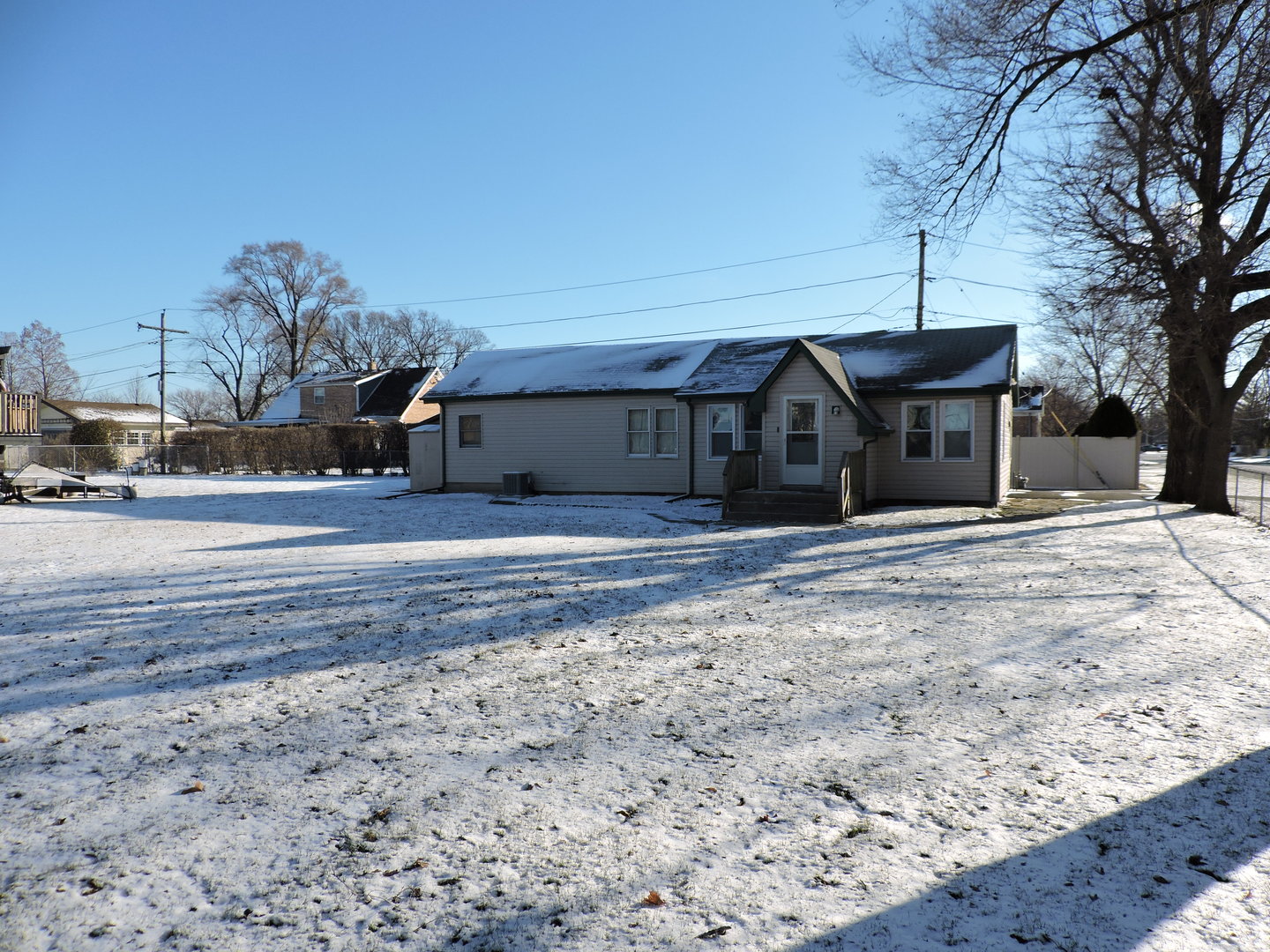 7749 79th Place Bridgeview, IL 60455 - Photo 19 of 19 a view of a house with a yard