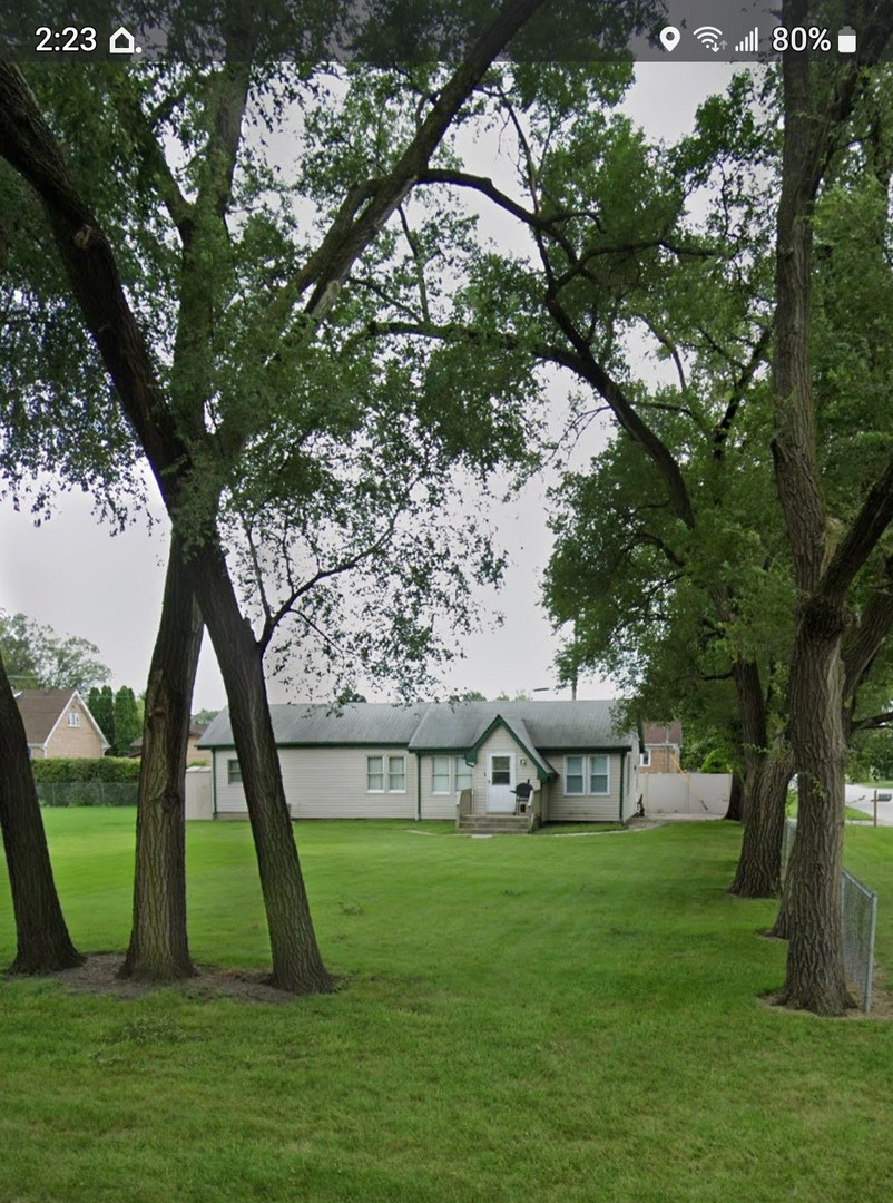 7749 79th Place Bridgeview, IL 60455 - Photo 2 of 19 a view of a park with a tree