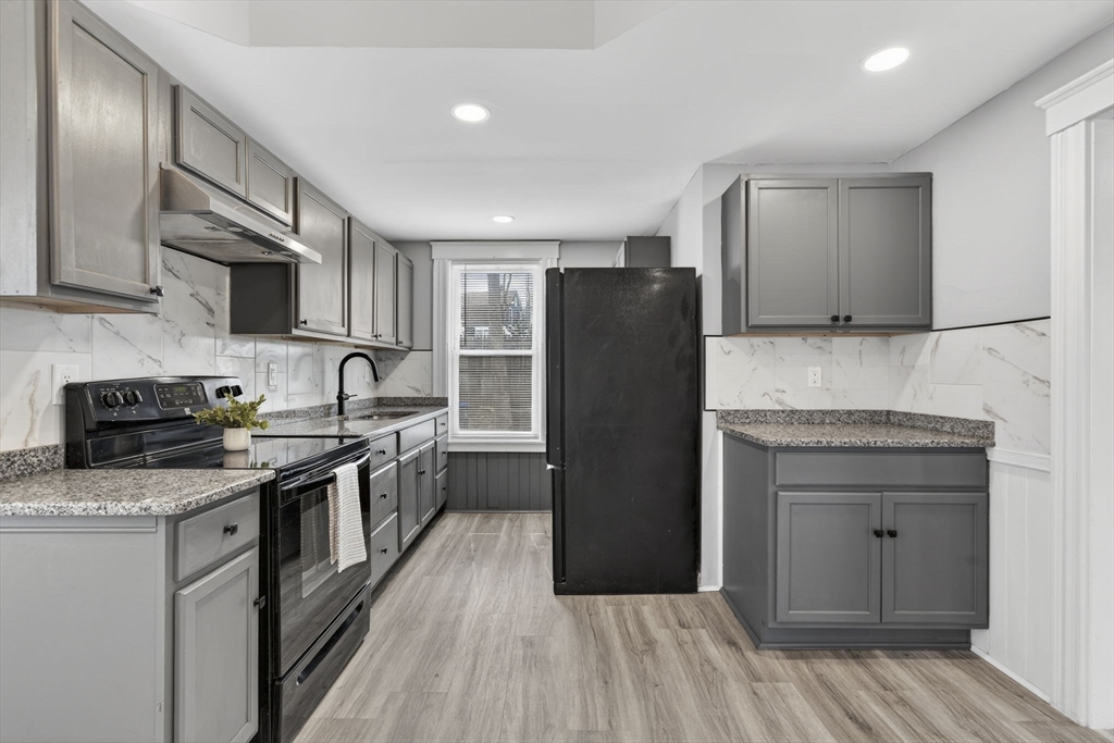 22 Maple Street Templeton, MA 01436 - Photo 6 of 28 a kitchen with stainless steel appliances granite countertop a refrigerator stove and sink