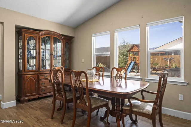 a view of a dining room with furniture window and outside view