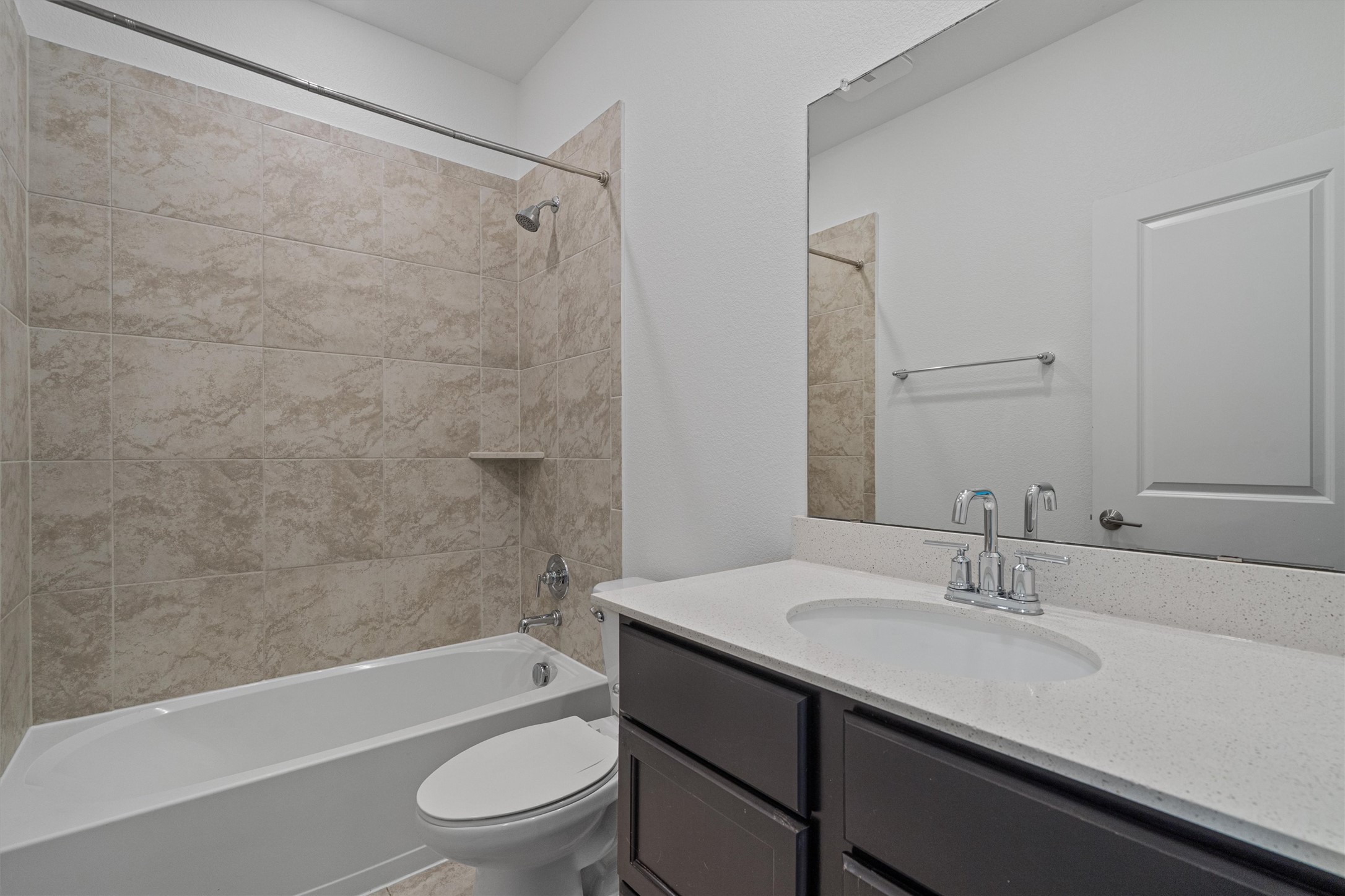 104 Stinchcomb Road Hutto, TX 78634 - Photo 26 of 40 The full bathroom is conveniently located between Bedrooms 2 and 3.