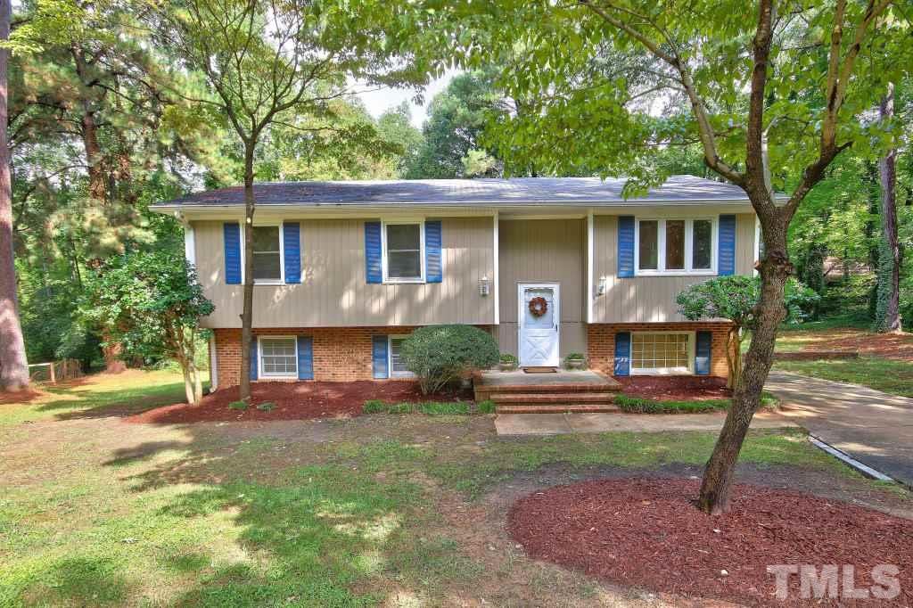 7609 Rambeau Circle Raleigh, NC 27613 - Photo 1 of 22 a front view of a house with a yard