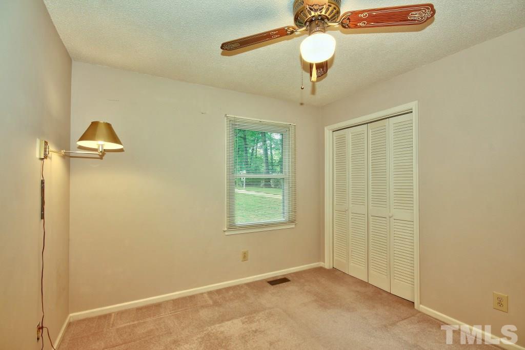 7609 Rambeau Circle Raleigh, NC 27613 - Photo 12 of 22 a view of an empty room with a window