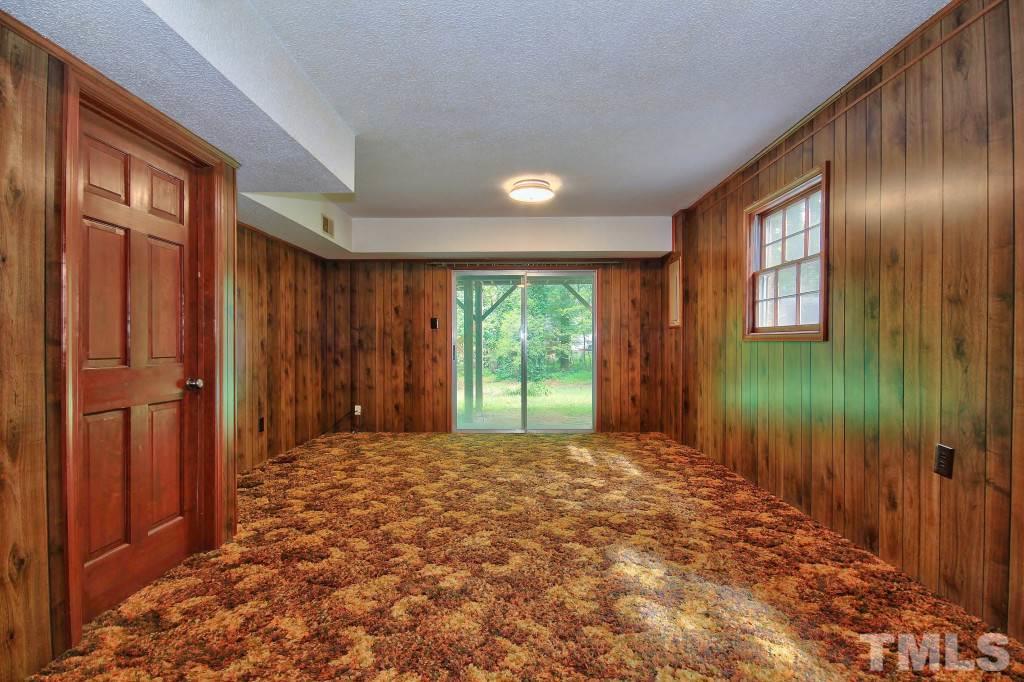 7609 Rambeau Circle Raleigh, NC 27613 - Photo 16 of 22 a view of an empty room with a window