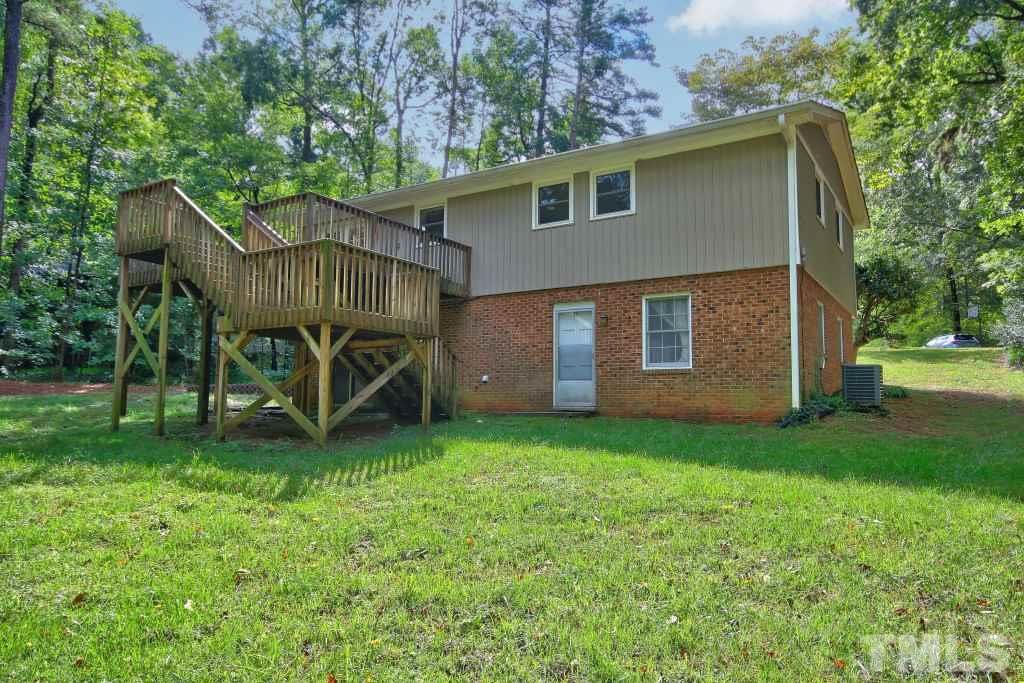 7609 Rambeau Circle Raleigh, NC 27613 - Photo 21 of 22 a view of a house with a yard