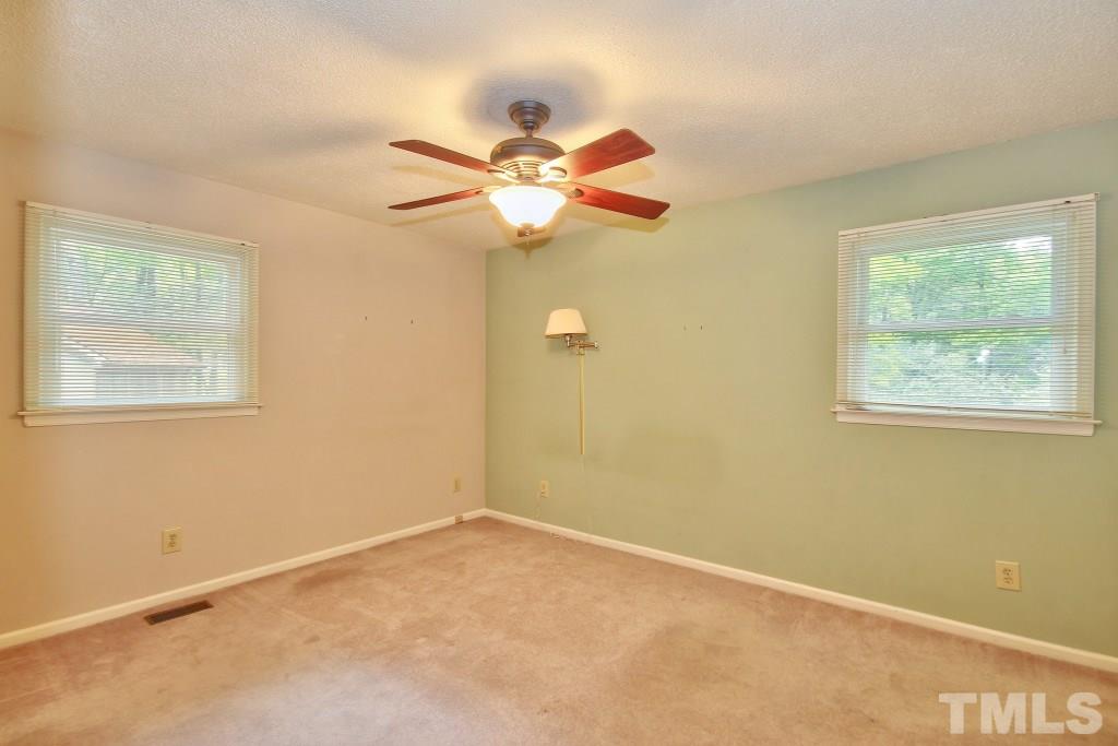 7609 Rambeau Circle Raleigh, NC 27613 - Photo 9 of 22 a view of room with window and ceiling fan