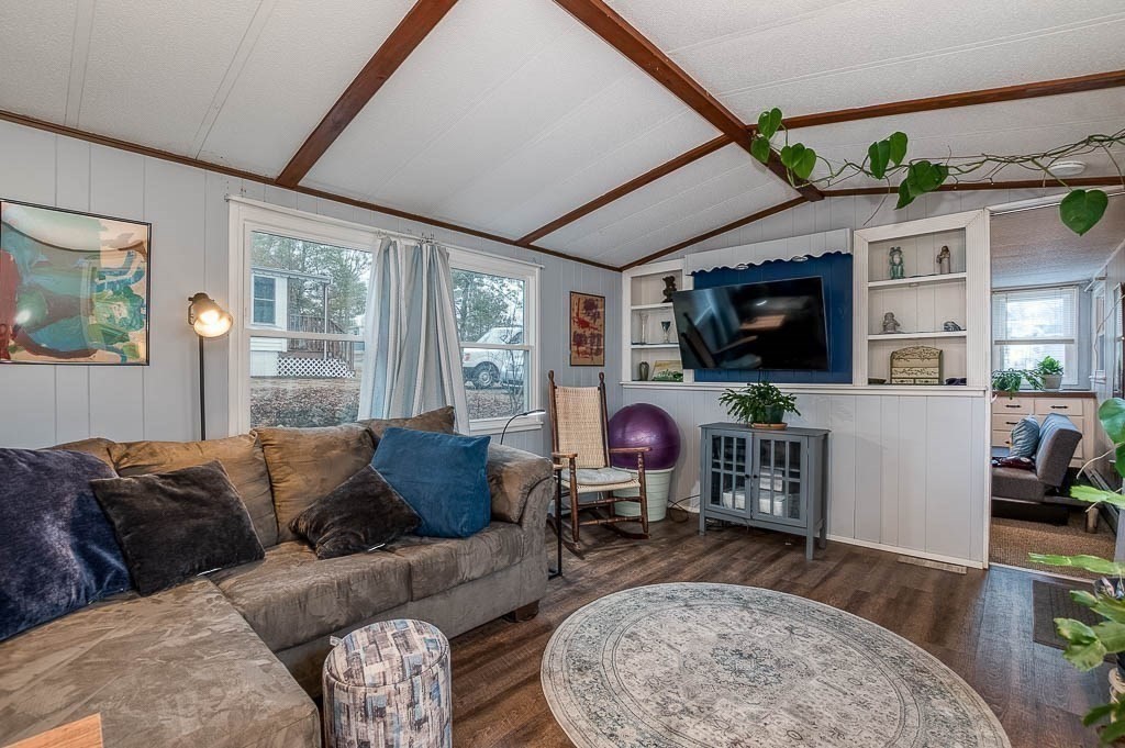 5 Timber Lane Wareham, MA 02571 - Photo 11 of 31 a living room with furniture a flat screen tv and windows