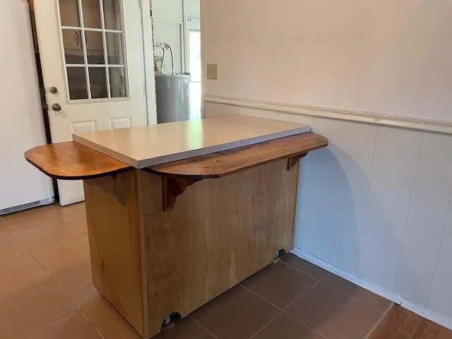 a view of kitchen island with furniture and wooden floor