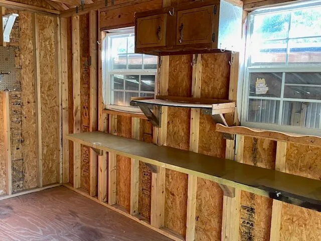 a side view of a house with a yard