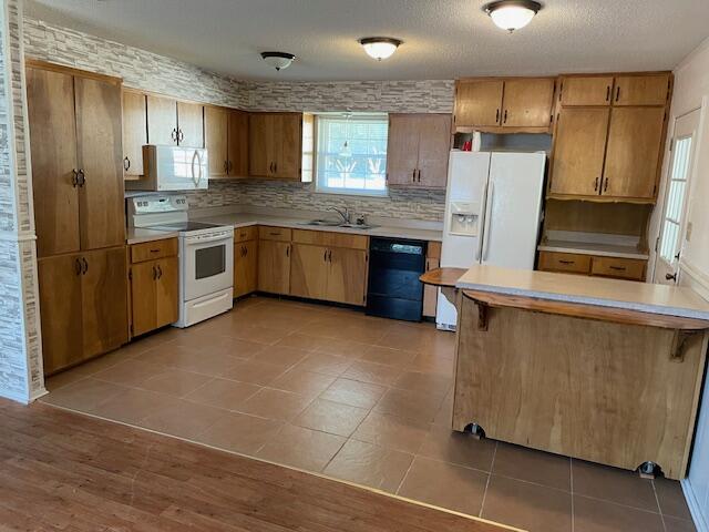 3107 Mayhair Road Crestview, FL 32539 - Photo 8 of 33 a large kitchen with stainless steel appliances granite countertop a refrigerator and a stove top oven