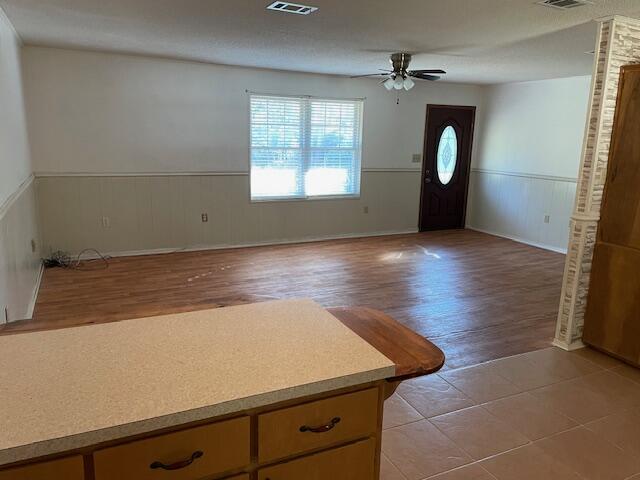 3107 Mayhair Road Crestview, FL 32539 - Photo 10 of 33 an empty room with wooden floor fan and windows