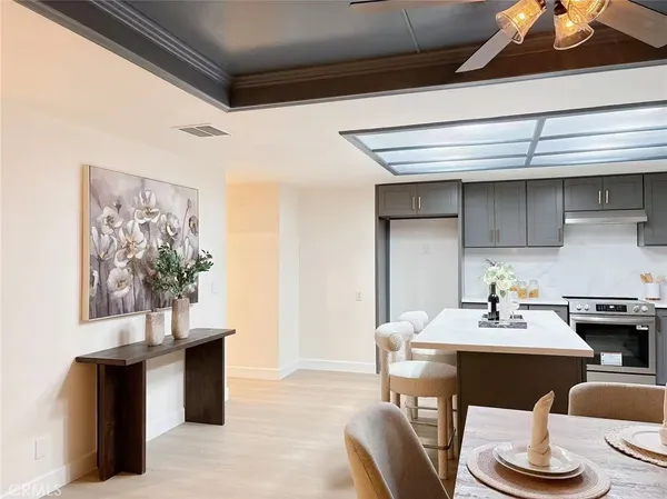 a dining room with furniture and window