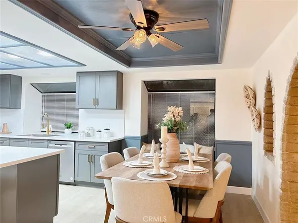 a dining room with furniture and window