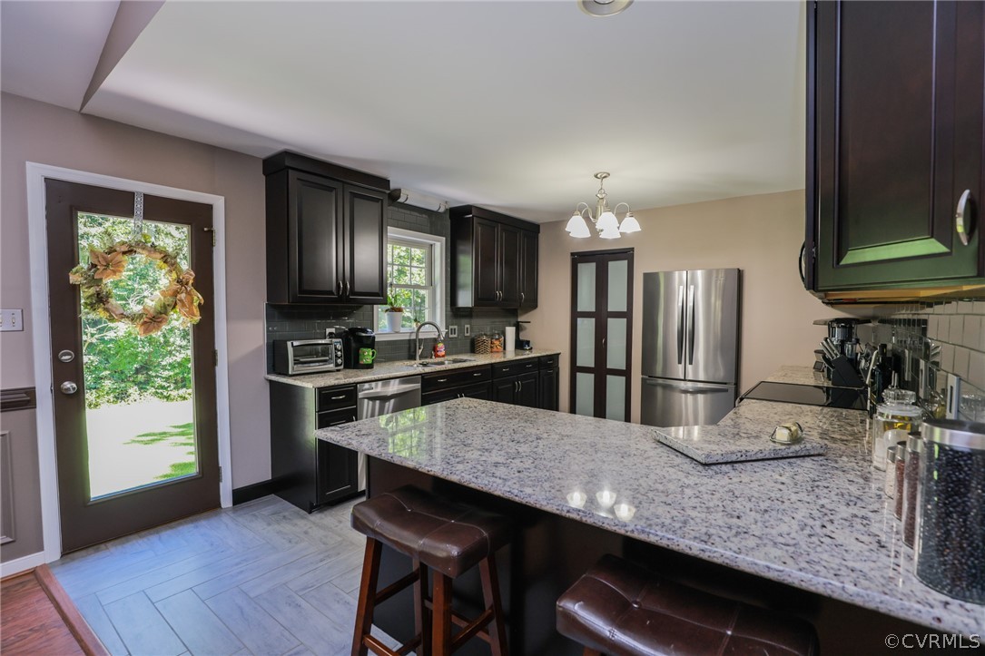 11706 Corte Castle Road Chesterfield, VA 23838 - Photo 13 of 44 a kitchen with stainless steel appliances granite countertop a sink refrigerator and microwave