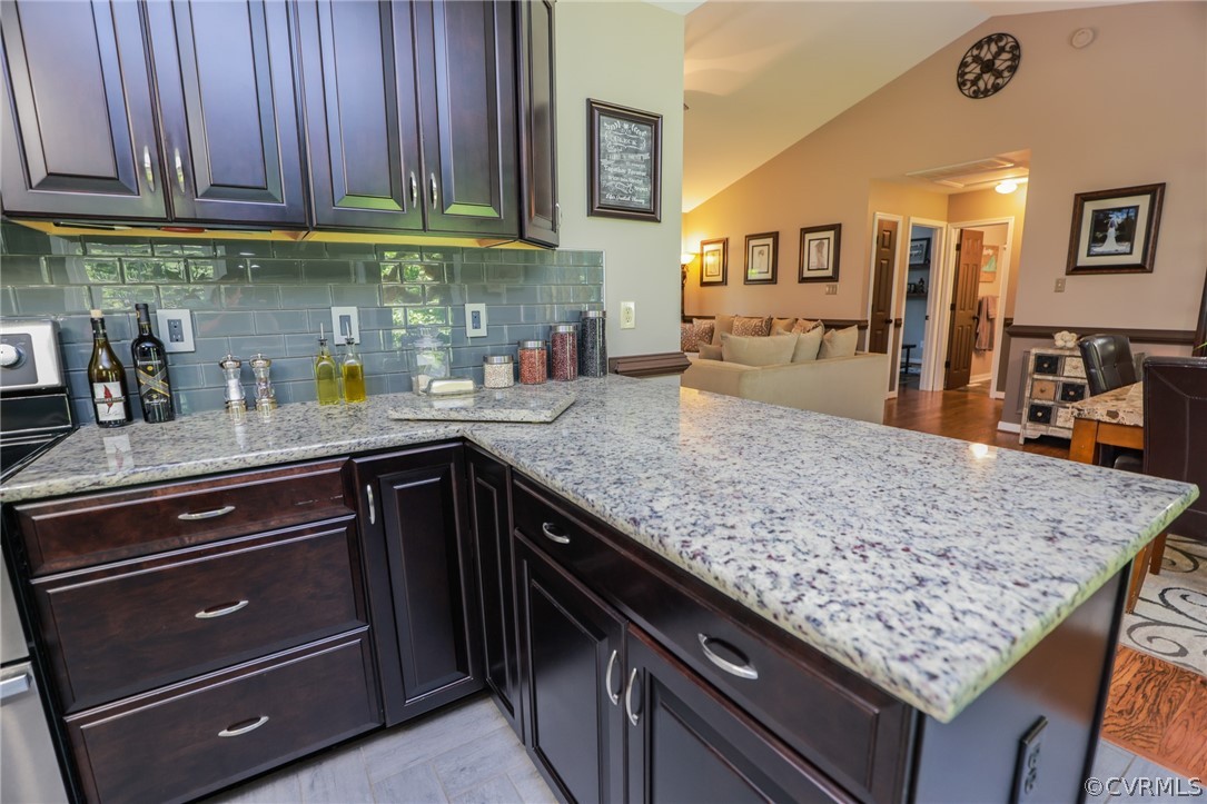 11706 Corte Castle Road Chesterfield, VA 23838 - Photo 16 of 44 a kitchen with stainless steel appliances granite countertop a counter space and wooden cabinets