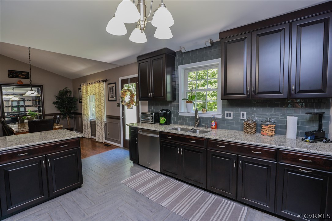 11706 Corte Castle Road Chesterfield, VA 23838 - Photo 17 of 44 a kitchen with stainless steel appliances granite countertop wooden cabinets a stove a sink and dishwasher