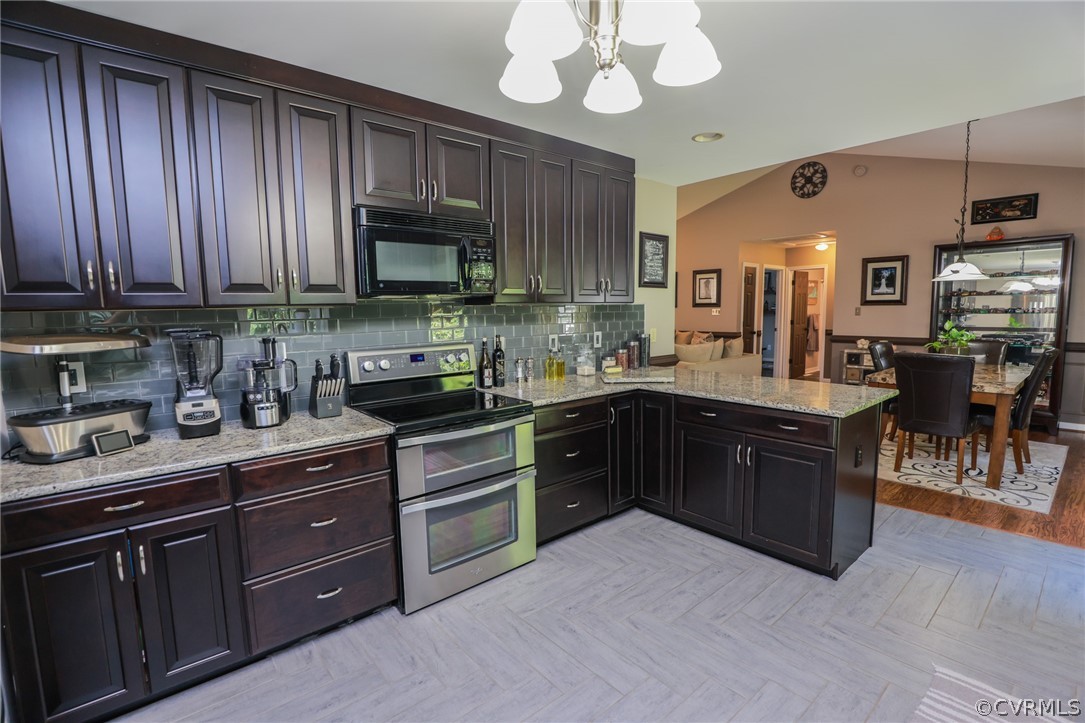 11706 Corte Castle Road Chesterfield, VA 23838 - Photo 18 of 44 a kitchen with stainless steel appliances granite countertop wooden cabinets a stove top oven a sink and dishwasher