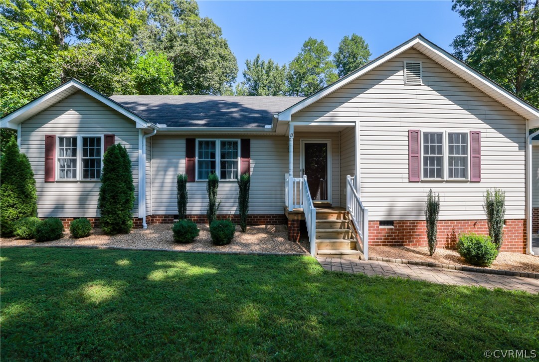 11706 Corte Castle Road Chesterfield, VA 23838 - Photo 2 of 44 a front view of a house with a yard and garage