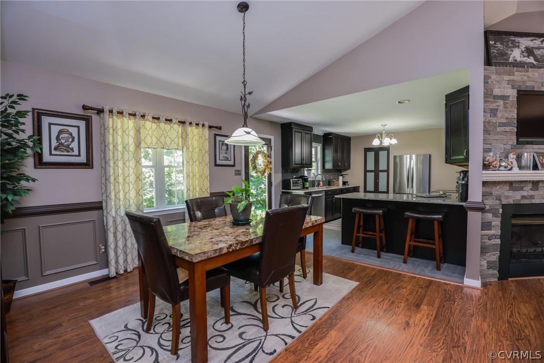 11706 Corte Castle Road Chesterfield, VA 23838 - Photo 21 of 44 a view of a dining room with furniture window and wooden floor