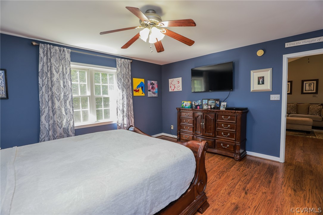 11706 Corte Castle Road Chesterfield, VA 23838 - Photo 24 of 44 a bedroom with a bed and a flat screen tv