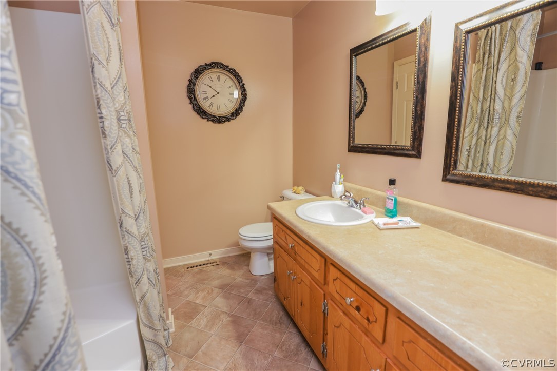 11706 Corte Castle Road Chesterfield, VA 23838 - Photo 25 of 44 a bathroom with a granite countertop sink and a mirror