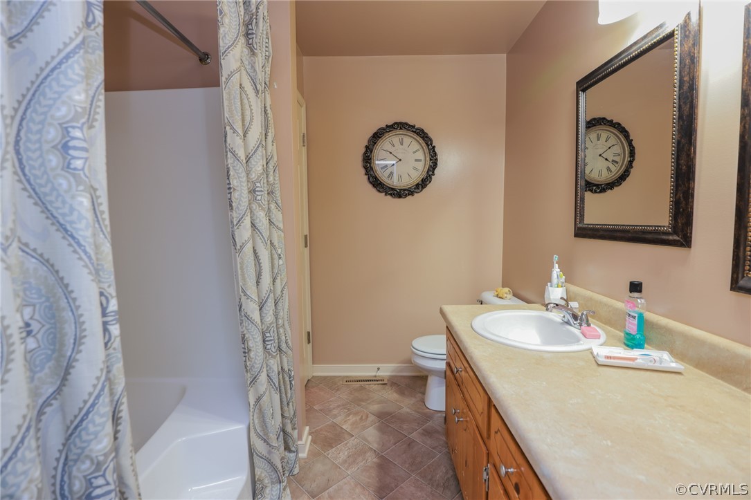 11706 Corte Castle Road Chesterfield, VA 23838 - Photo 26 of 44 a bathroom with a sink and a mirror