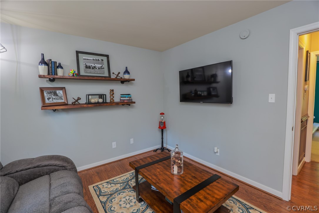 11706 Corte Castle Road Chesterfield, VA 23838 - Photo 28 of 44 a living room with furniture and a flat screen tv