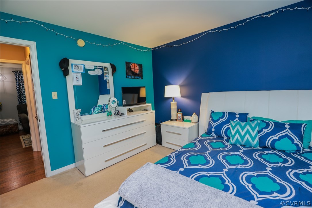 11706 Corte Castle Road Chesterfield, VA 23838 - Photo 31 of 44 a bed room with a bed and a dresser