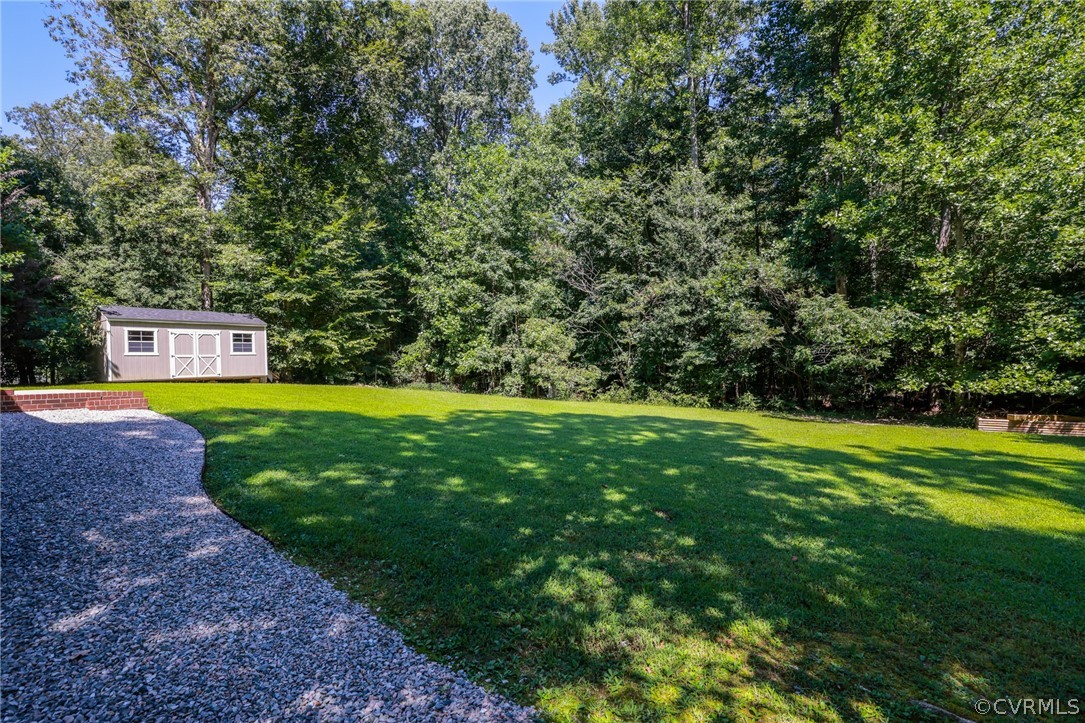 11706 Corte Castle Road Chesterfield, VA 23838 - Photo 35 of 44 a view of a swimming pool with a yard