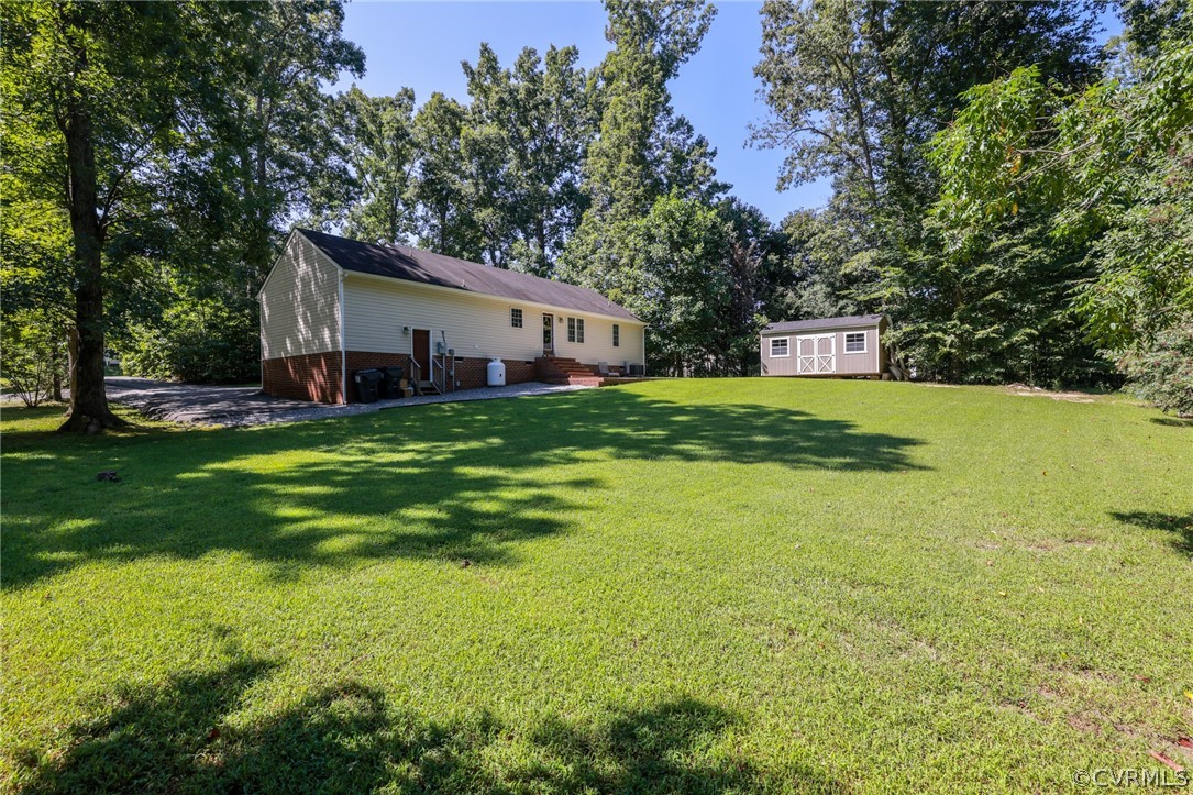11706 Corte Castle Road Chesterfield, VA 23838 - Photo 37 of 44 a view of a backyard with plants and large tree
