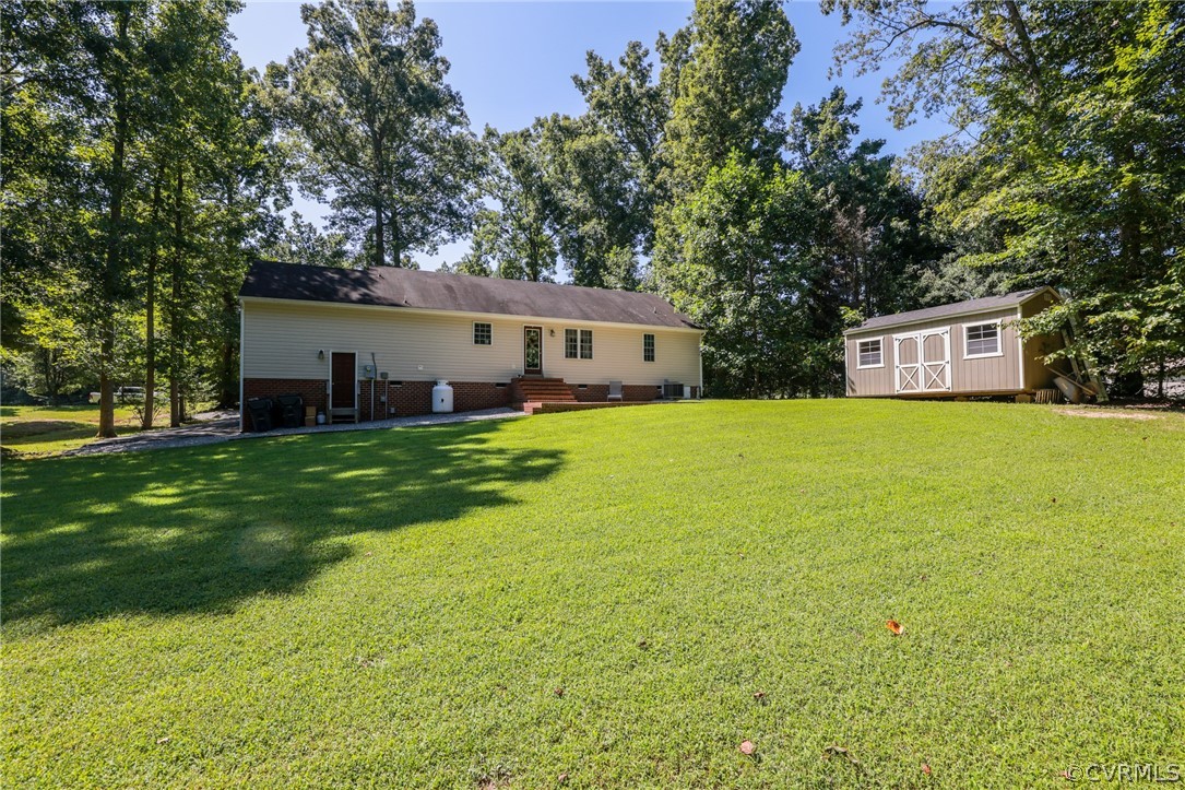 11706 Corte Castle Road Chesterfield, VA 23838 - Photo 38 of 44 a view of a house with a yard and sitting area