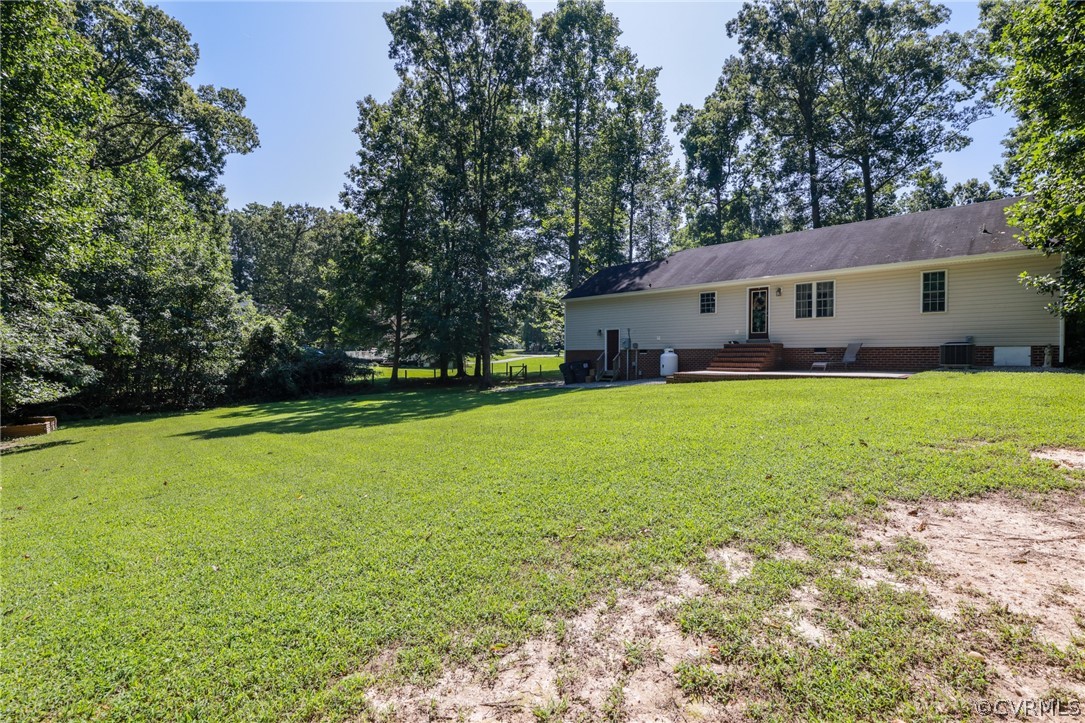 11706 Corte Castle Road Chesterfield, VA 23838 - Photo 39 of 44 a view of a house with a yard and a patio