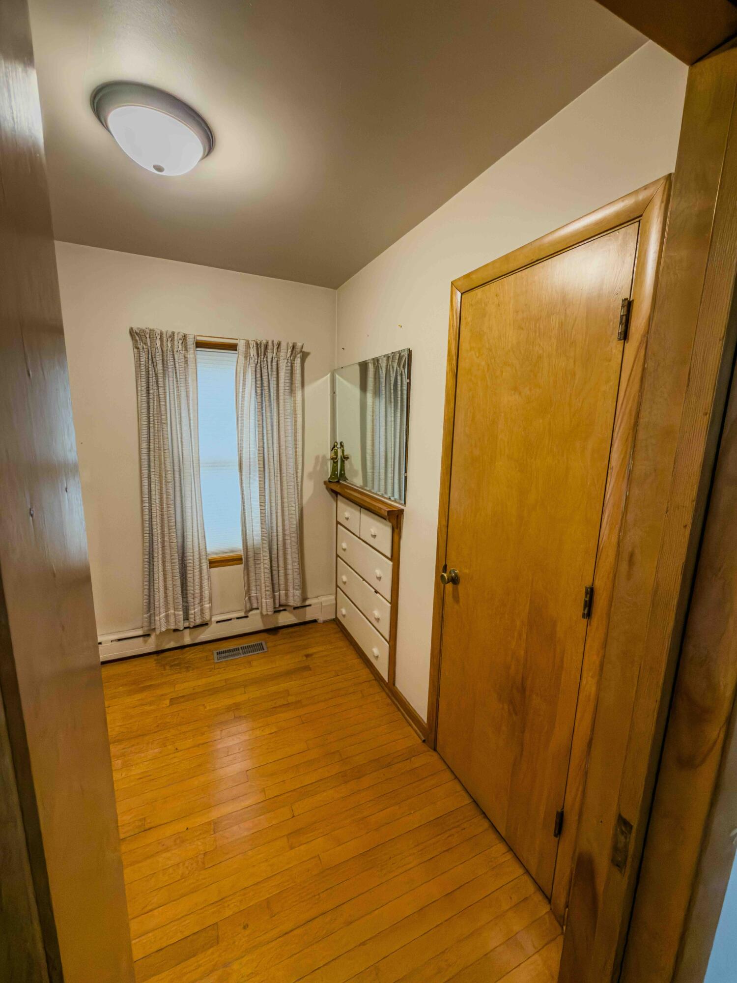1218 120th Street Whiting, IN 46394 - Photo 18 of 25 wooden floor in an empty room with a window