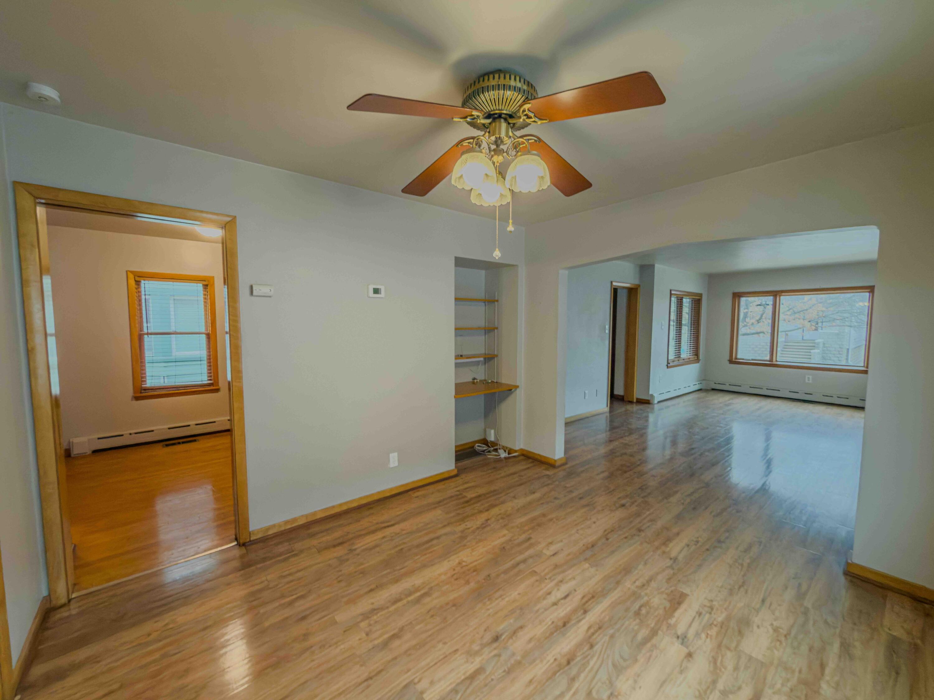 1218 120th Street Whiting, IN 46394 - Photo 6 of 25 a view of an empty room with wooden floor and a window