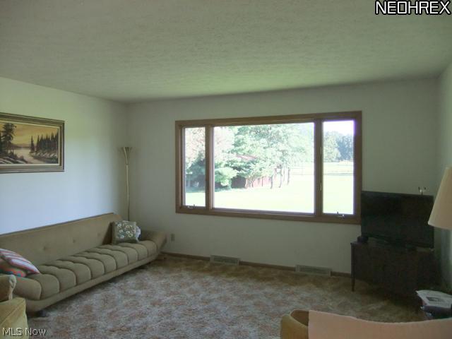 4293 Minor Road Akron, OH 44321 - Photo 4 of 21 The spacious living room offers a large picture windows with a wonderful view of the backyard.