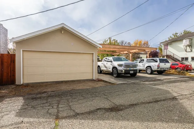 a view of a car park in front of house