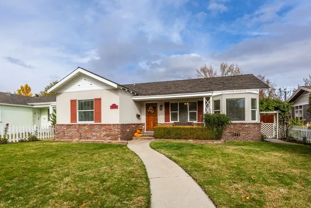 a front view of house with yard and green space