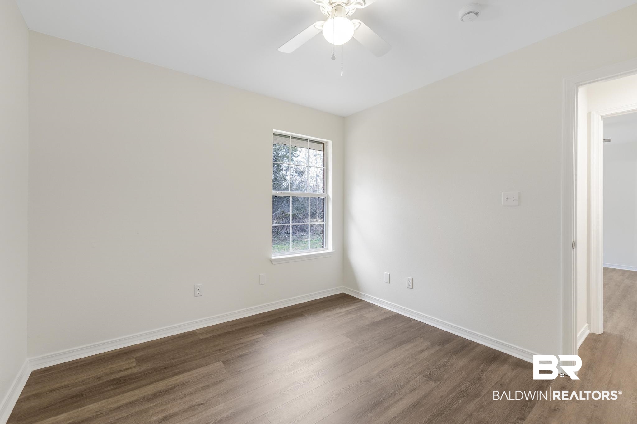 16330 Absalom Street Foley, AL 36535 - Photo 33 of 42 Unfurnished room with dark hardwood / wood-style flooring and ceiling fan
