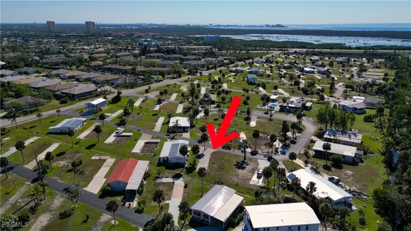 an aerial view of a building and yard