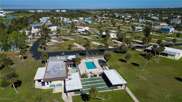 an aerial view of residential houses with outdoor space