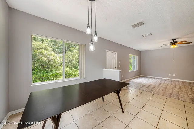 a kitchen with a sink stove top oven and refrigerator