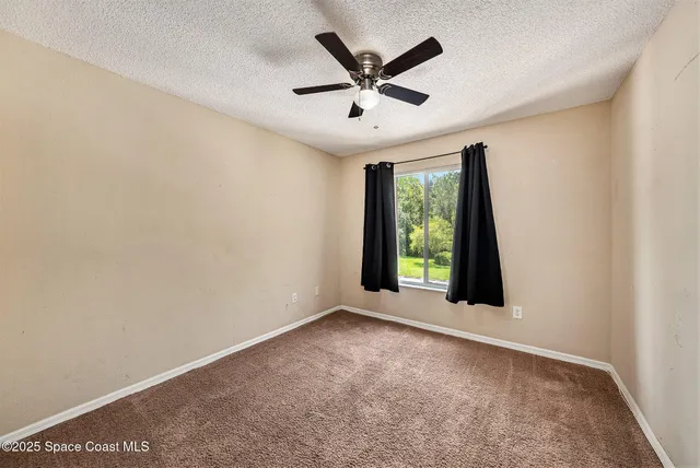 a view of a house with swimming pool and a yard
