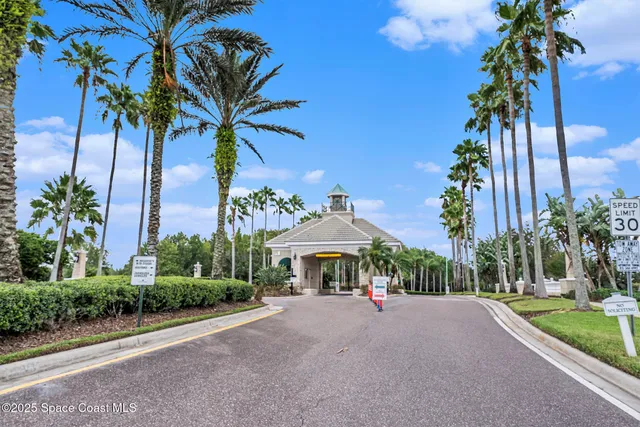 a front view of a house with a garden and a yard