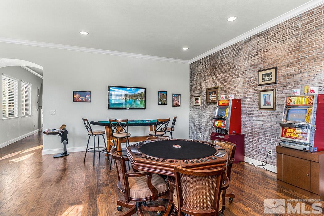 10589 Twin Bridges Way Reno, NV 89521 - Photo 15 of 34 a dining room with furniture and wooden floor