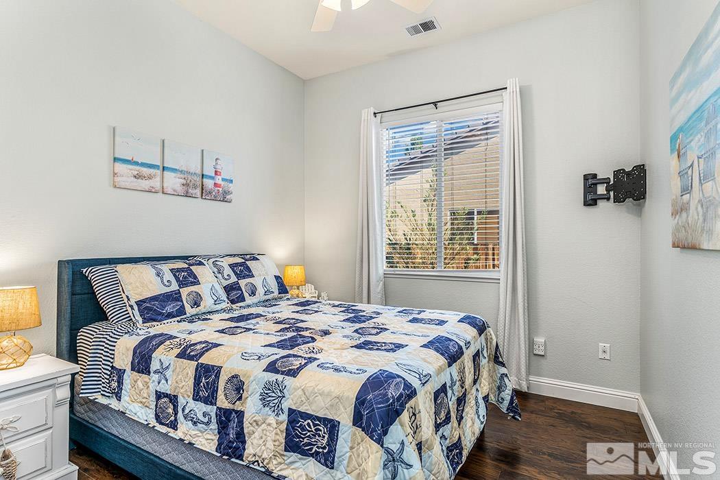10589 Twin Bridges Way Reno, NV 89521 - Photo 19 of 34 a bedroom with a bed next to a window