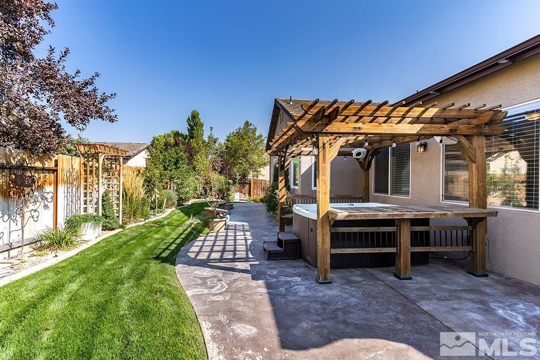 10589 Twin Bridges Way Reno, NV 89521 - Photo 23 of 34 a view of a house with backyard