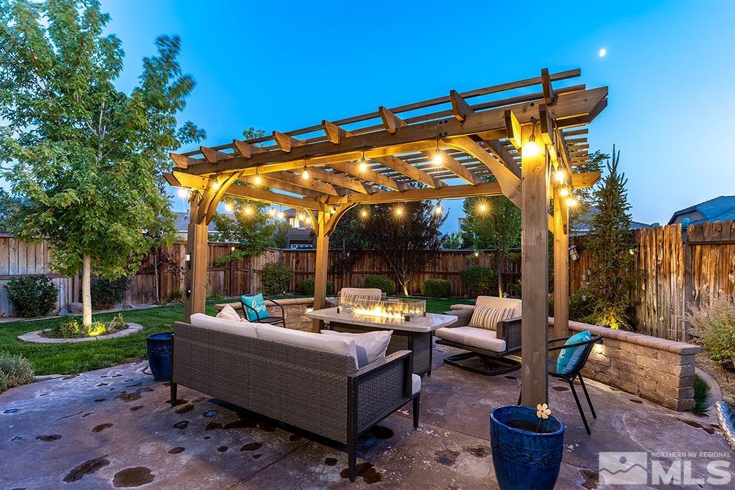 10589 Twin Bridges Way Reno, NV 89521 - Photo 27 of 34 a outdoor living space with furniture and garden view