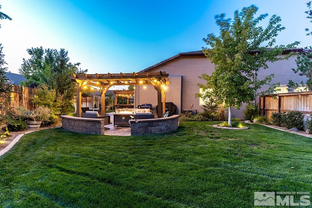 10589 Twin Bridges Way Reno, NV 89521 - Photo 29 of 34 a view of a house with backyard porch and sitting area