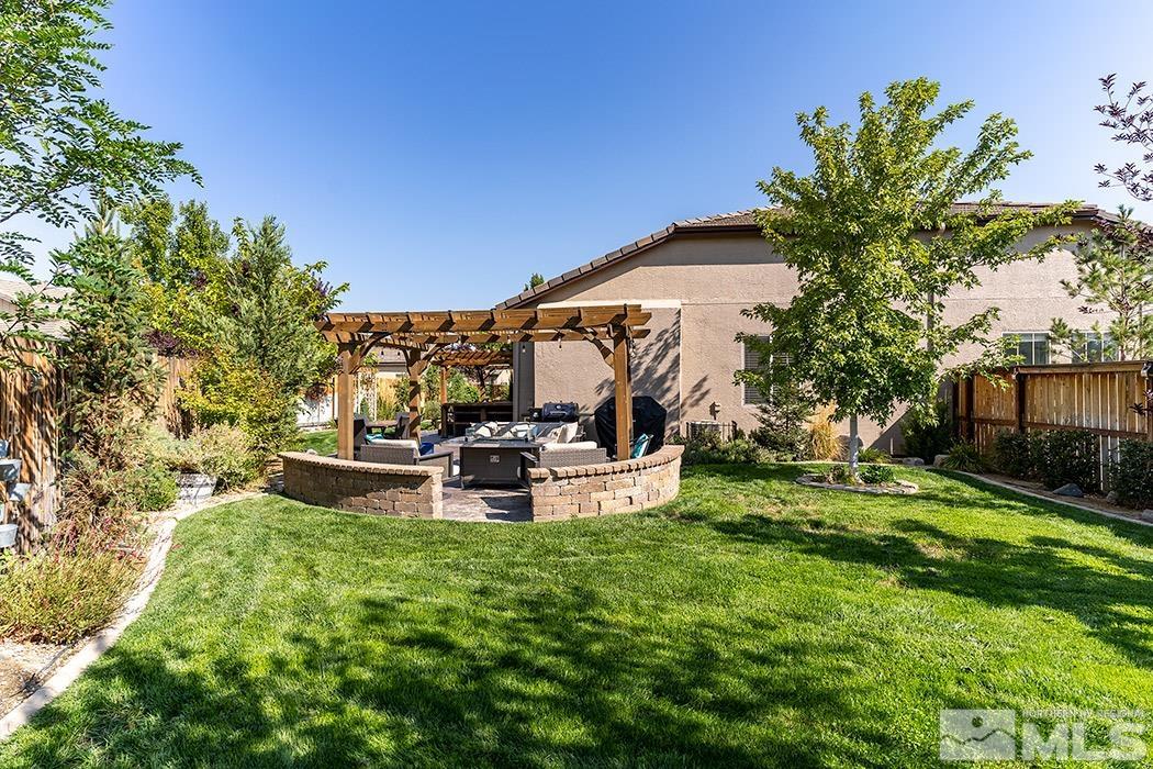 10589 Twin Bridges Way Reno, NV 89521 - Photo 30 of 34 a view of a house with backyard and sitting area
