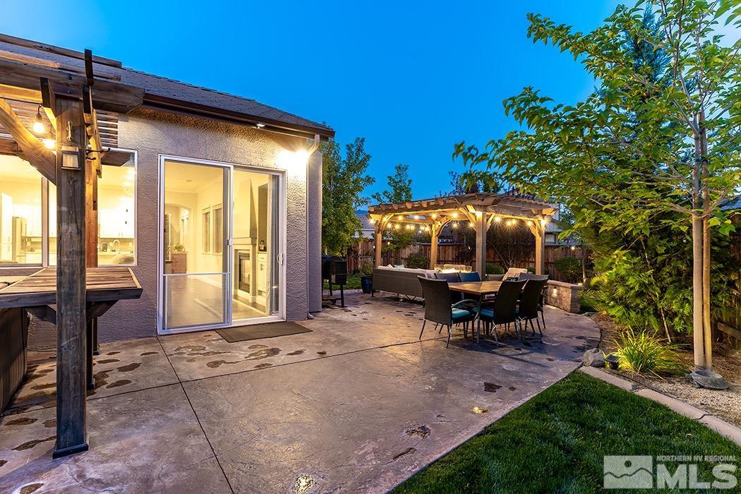 10589 Twin Bridges Way Reno, NV 89521 - Photo 31 of 34 a backyard of a house with table and chairs
